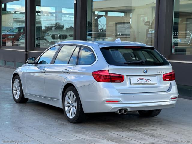 Auto - Bmw 320d touring business advantage aut.